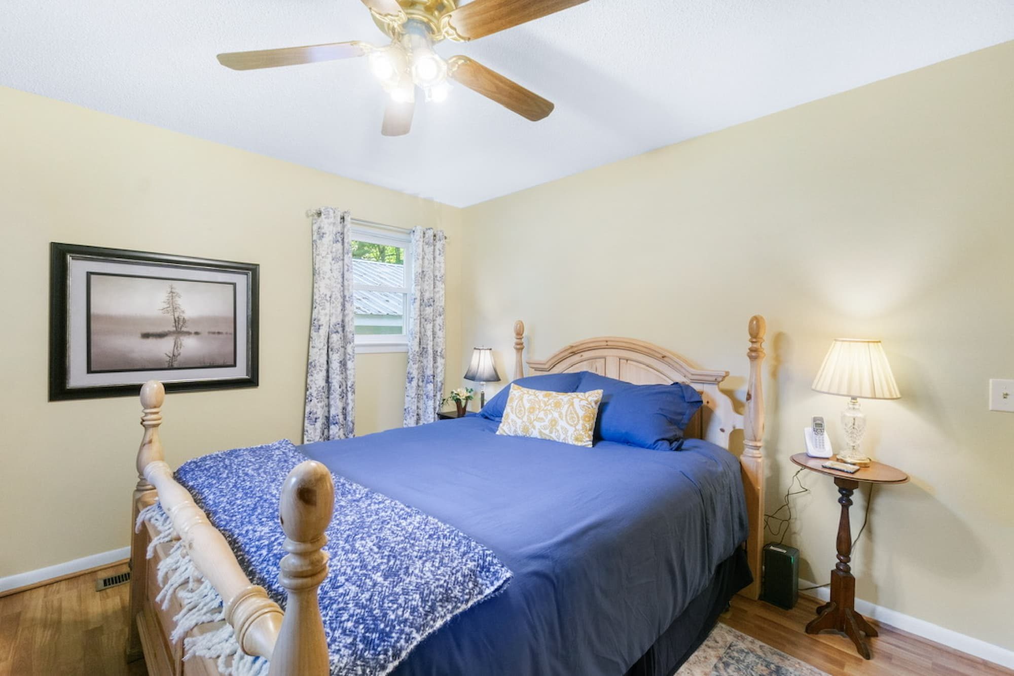 Queen bedroom in calming blues with four-poster bed