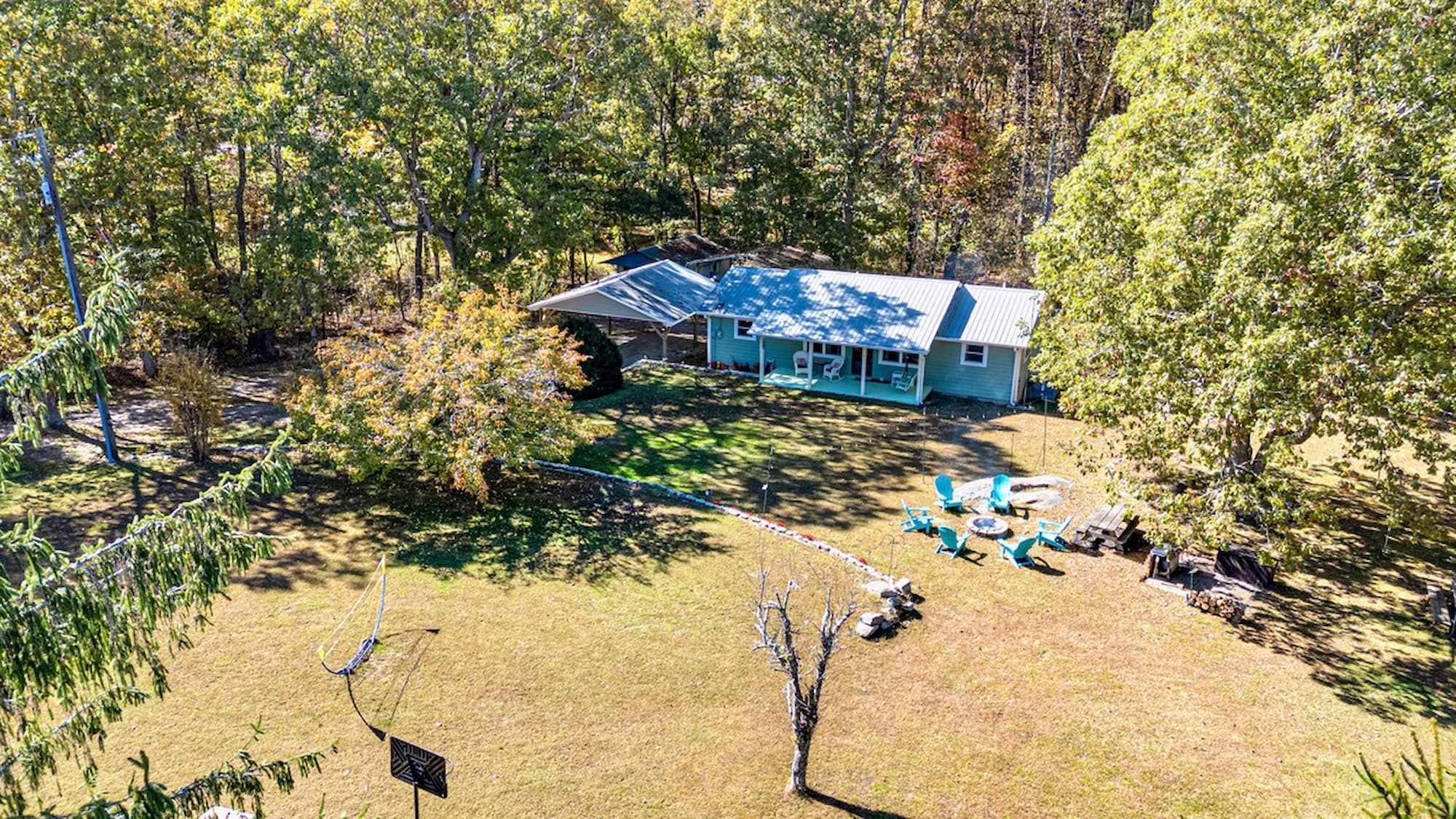 Aerial view of Pennington Place — the home, full acre, and fire pit tucked into the Lookout Mountain woods